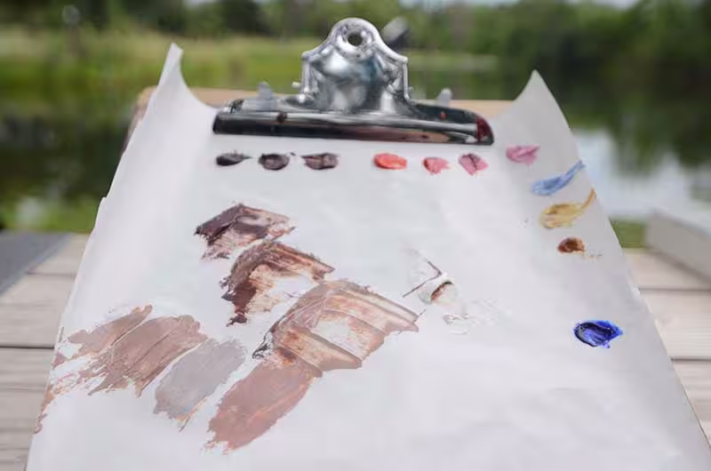 Paper painting palette with oil paint.